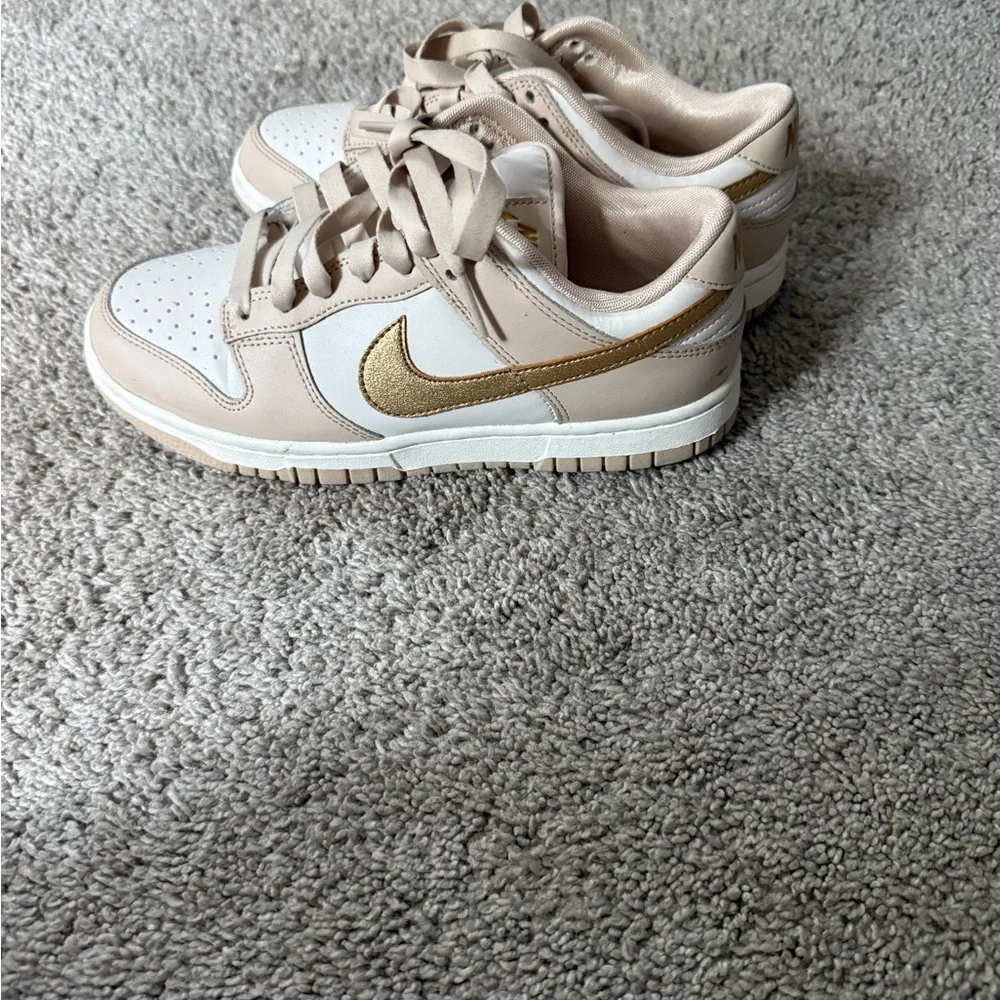 Nike dunks low gold swoosh